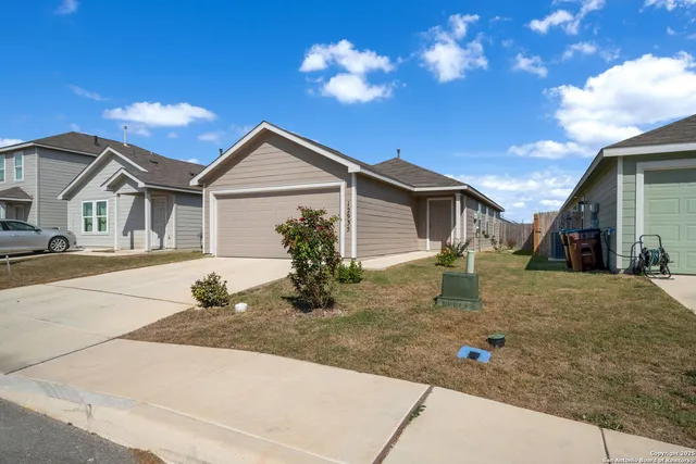 a front view of a house with yard