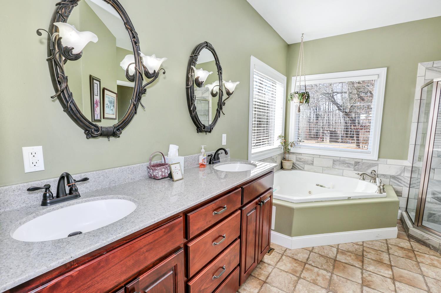 42 Partin Road Taft, TN 38488 - Photo 18 of 30 a bathroom with a double vanity sink mirror and bathtub
