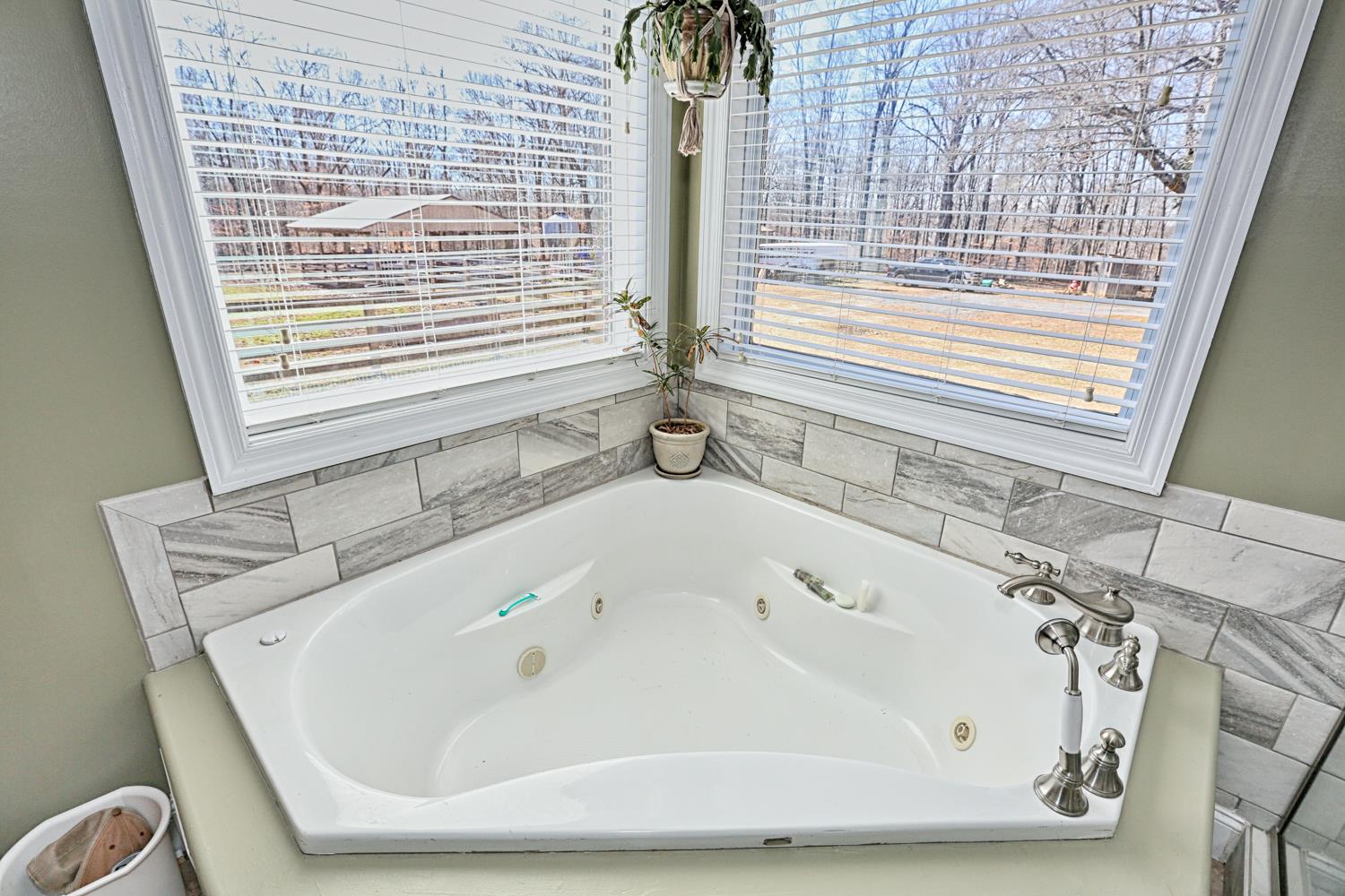 42 Partin Road Taft, TN 38488 - Photo 20 of 30 a white bath tub sitting in a bathroom next to a window