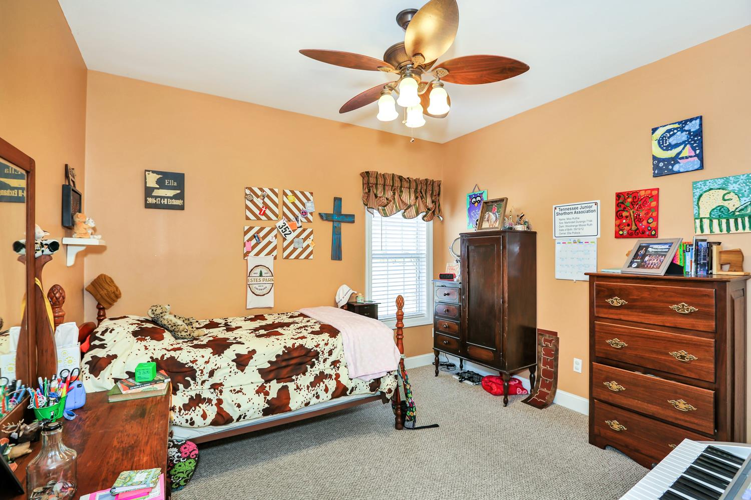 42 Partin Road Taft, TN 38488 - Photo 21 of 30 a bedroom with a bed and a chandelier