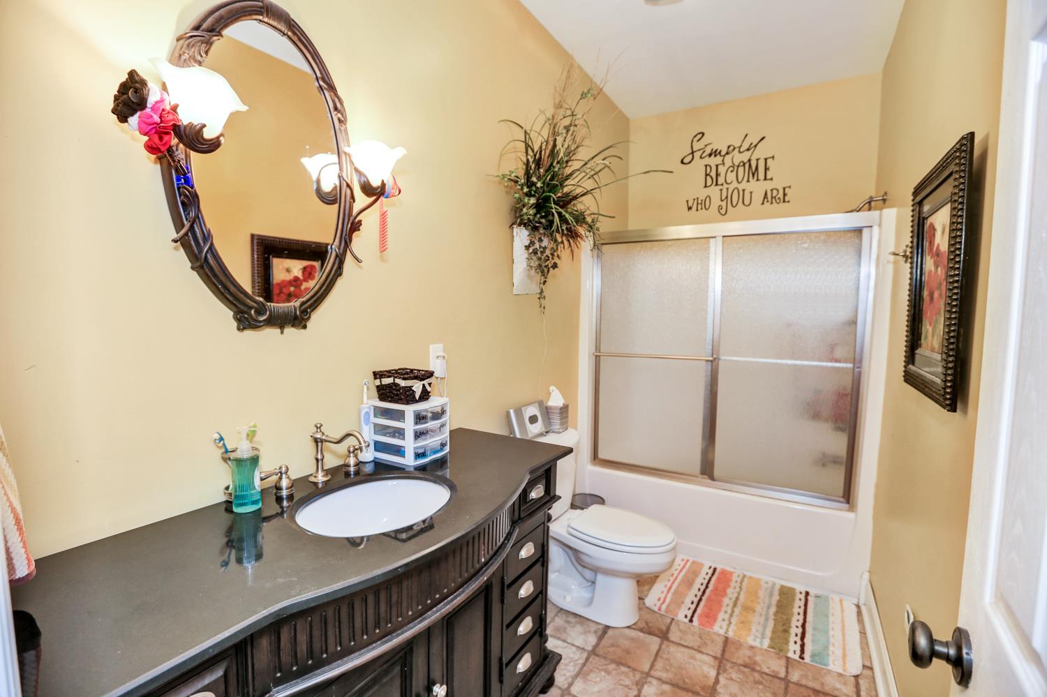 42 Partin Road Taft, TN 38488 - Photo 23 of 30 a bathroom with a sink a mirror and a toilet