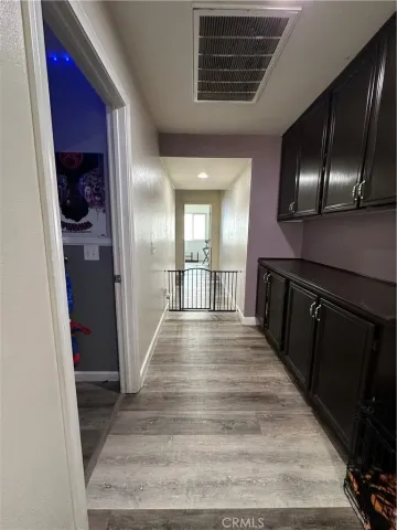 a view of room with a flat screen tv and windows