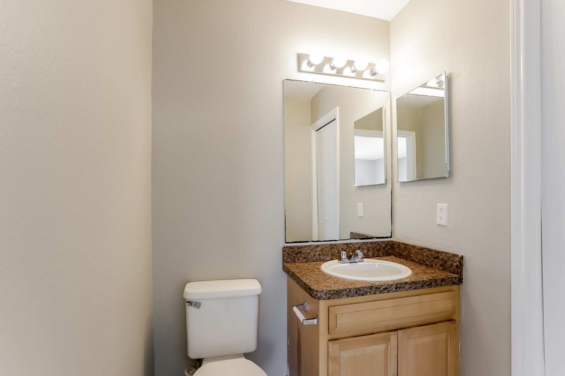 7744 Ellis Drive Houston, TX 77489 - Photo 13 of 17 a bathroom with a granite countertop sink a toilet and a mirror
