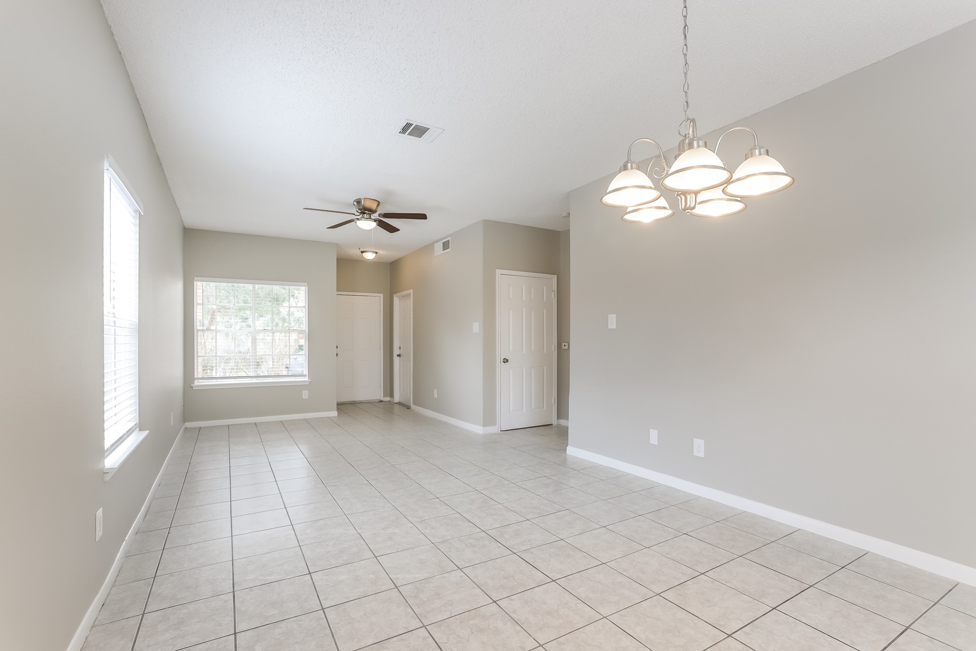 7744 Ellis Drive Houston, TX 77489 - Photo 3 of 17 wooden floor in an empty room with a window
