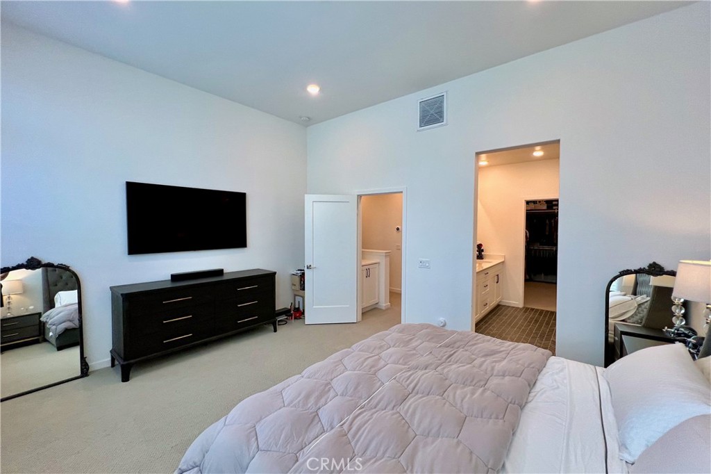 717 South Grable Circle Orange, CA 92868 - Photo 23 of 60 a bedroom with furniture and a flat screen tv