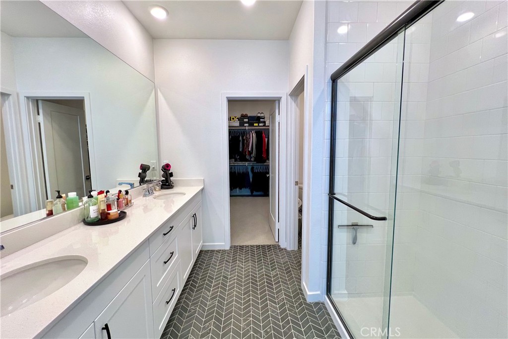 717 South Grable Circle Orange, CA 92868 - Photo 27 of 60 a bathroom with a double vanity sink and a mirror
