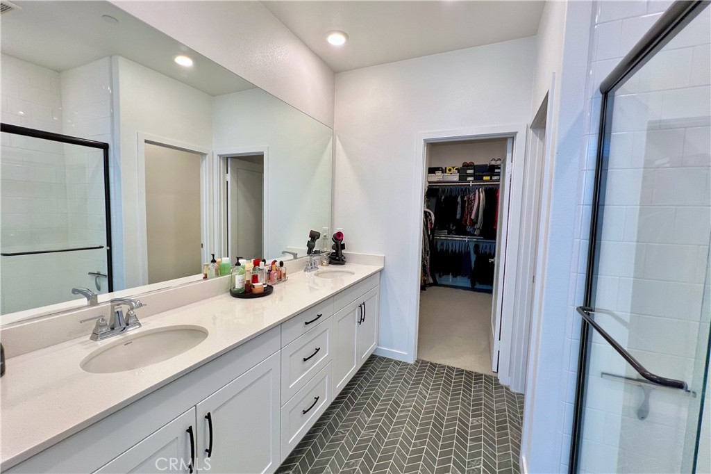 717 South Grable Circle Orange, CA 92868 - Photo 28 of 60 a bathroom with a double vanity sink and a mirror