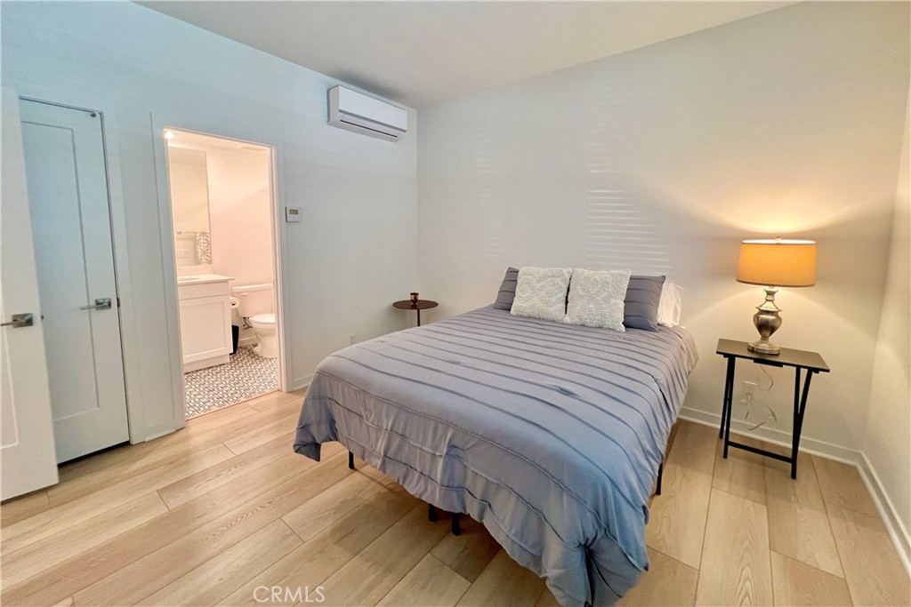 717 South Grable Circle Orange, CA 92868 - Photo 35 of 60 a bedroom with a bed and a table