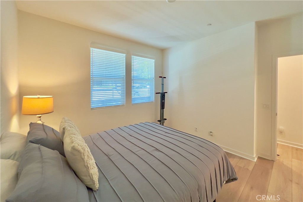 717 South Grable Circle Orange, CA 92868 - Photo 37 of 60 a bedroom with a bed and a lamp