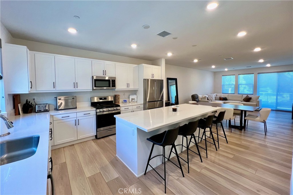 717 South Grable Circle Orange, CA 92868 - Photo 7 of 60 a kitchen with a table and chairs in it