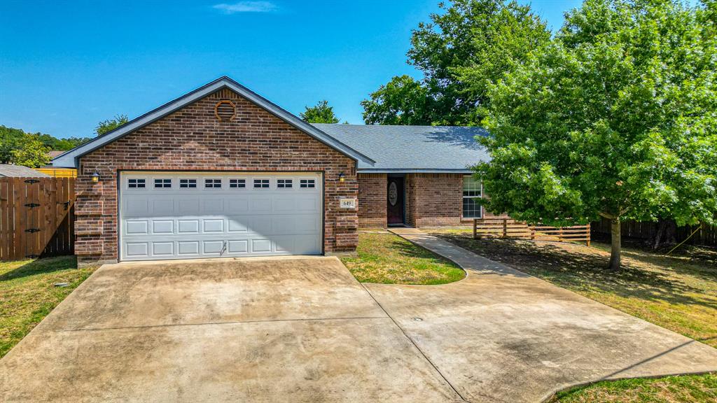 649 North Stewart Street Azle, TX 76020 - Photo 1 of 1 a view of backyard of house