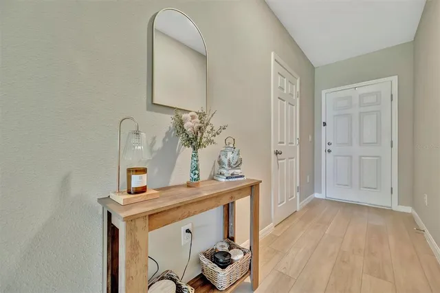 a view of an entryway with wooden floor