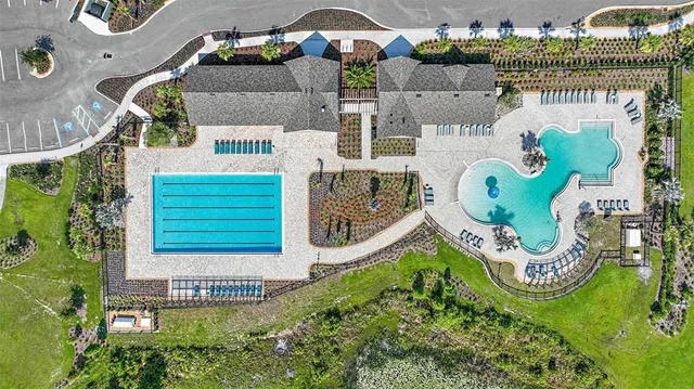 an aerial view of a house with garden space ocean view