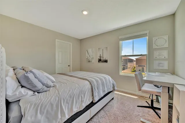 a bedroom with a bed and a table in it