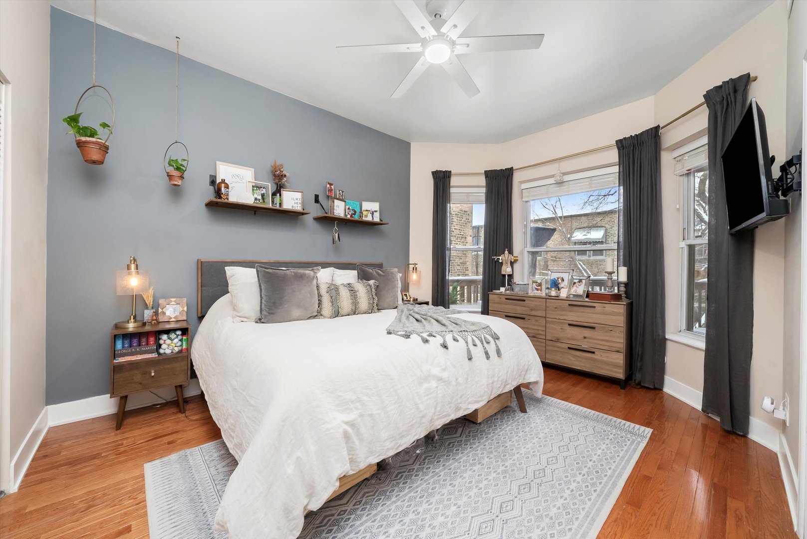 2839 North Burling Street, Unit 3N Chicago, IL 60657 - Photo 14 of 32 a bedroom with a bed and a flat tv screen on dresser