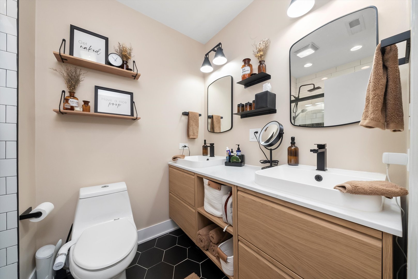 2839 North Burling Street, Unit 3N Chicago, IL 60657 - Photo 17 of 32 a bathroom with a toilet sink and mirror