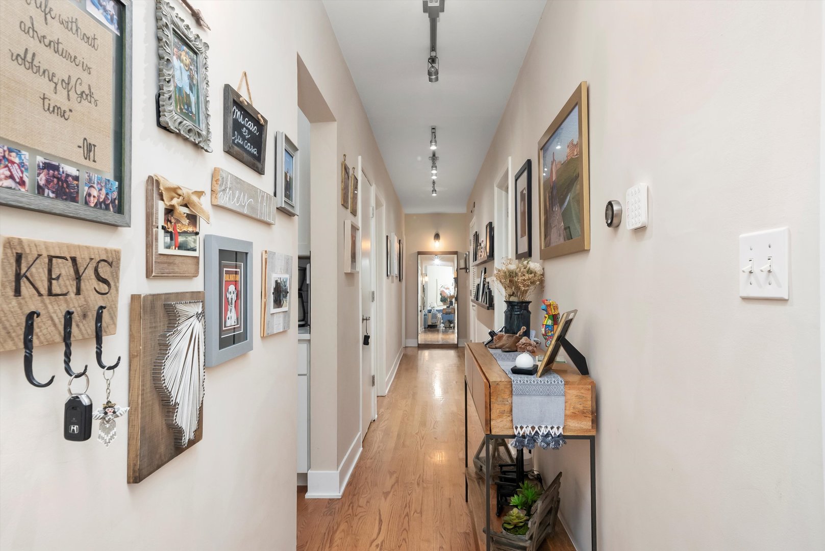 2839 North Burling Street, Unit 3N Chicago, IL 60657 - Photo 24 of 32 a view of a hallway with wooden floor