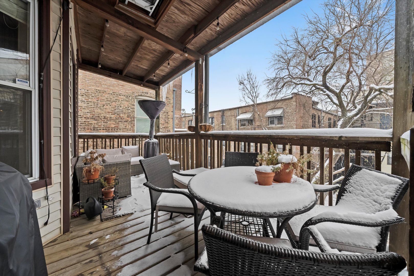 2839 North Burling Street, Unit 3N Chicago, IL 60657 - Photo 30 of 32 a balcony with table and chairs