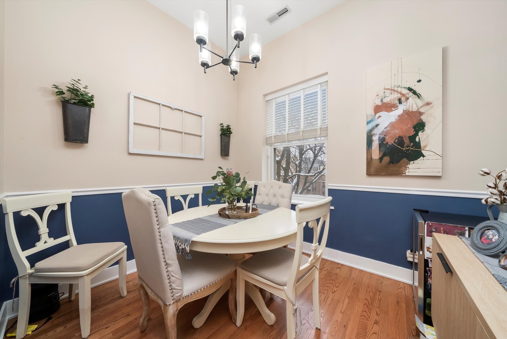 2839 North Burling Street, Unit 3N Chicago, IL 60657 - Photo 7 of 32 a view of a dining room with furniture wooden floor and a chandelier