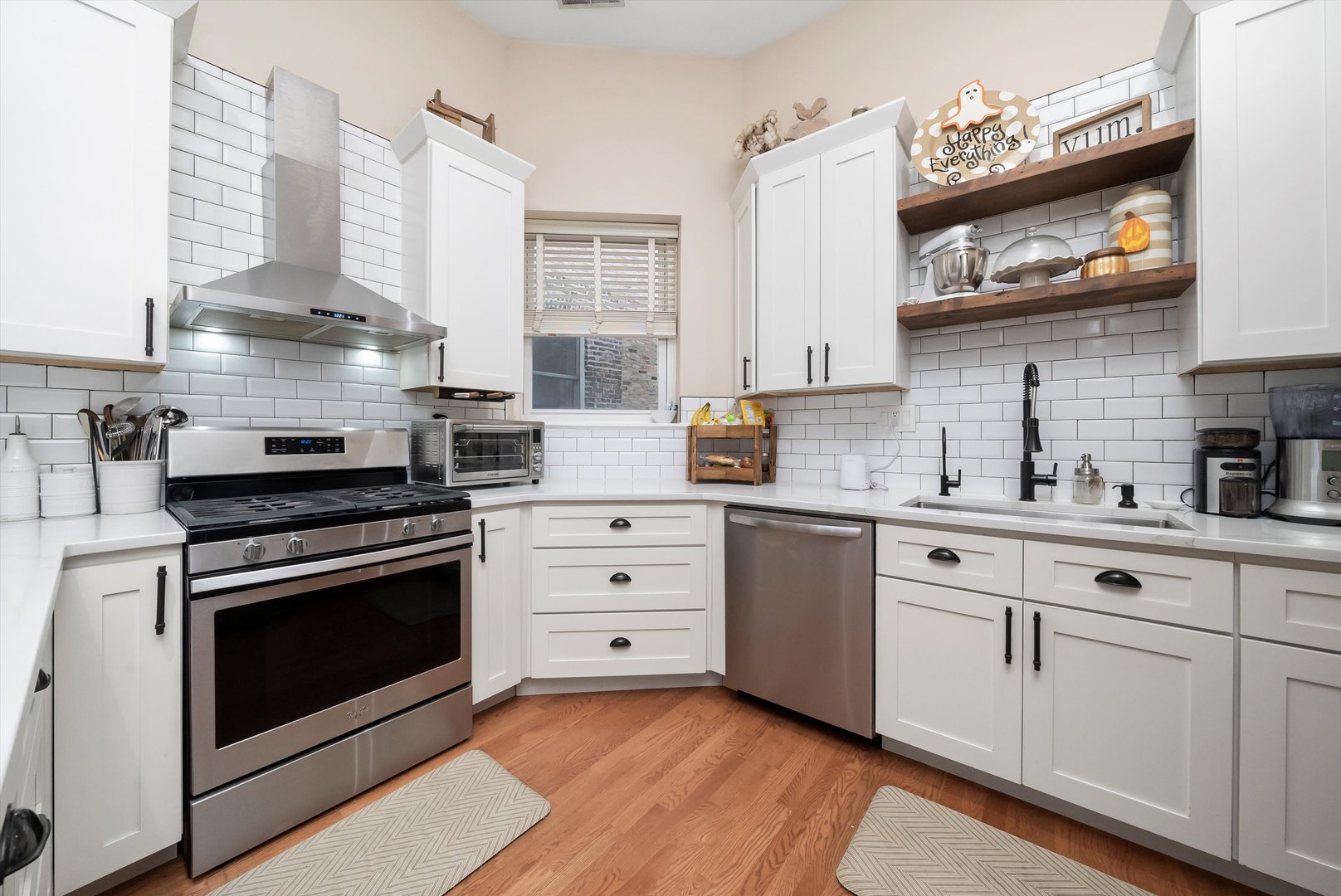 2839 North Burling Street, Unit 3N Chicago, IL 60657 - Photo 10 of 32 a kitchen with stainless steel appliances granite countertop a stove and cabinets