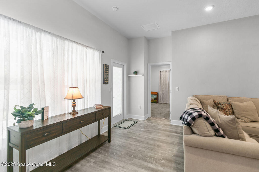 711 Tupelo Circle Cocoa, FL 32926 - Photo 18 of 47 a living room with furniture and a potted plant