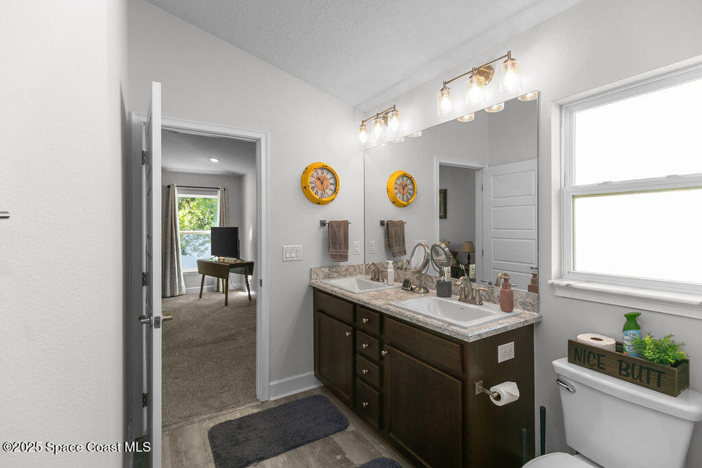 711 Tupelo Circle Cocoa, FL 32926 - Photo 24 of 47 a bathroom with a sink and a mirror