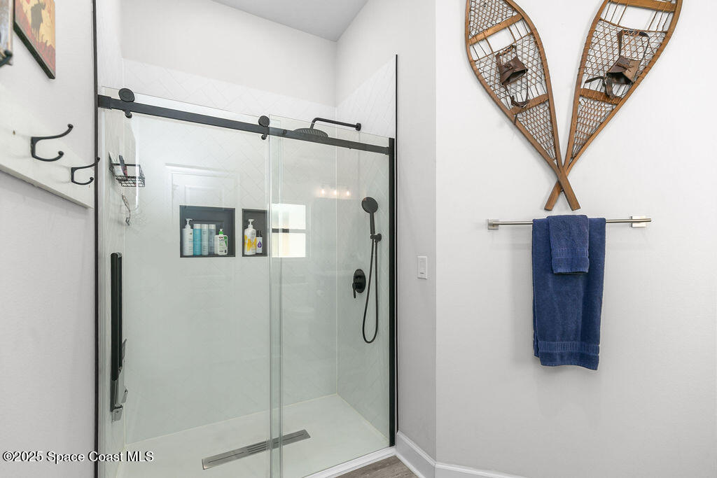 711 Tupelo Circle Cocoa, FL 32926 - Photo 27 of 47 a bathroom with a shower and a sink