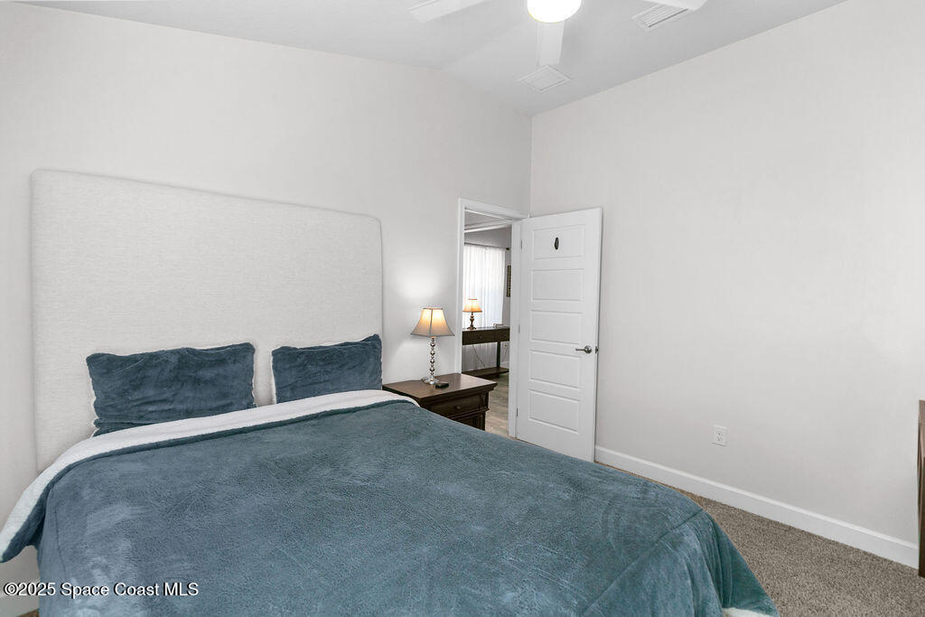 711 Tupelo Circle Cocoa, FL 32926 - Photo 29 of 47 a living room with furniture and a toilet