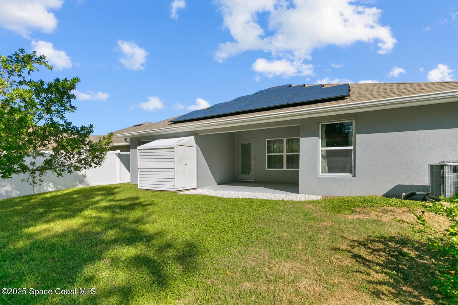 711 Tupelo Circle Cocoa, FL 32926 - Photo 39 of 47 a view of a backyard with plants and large tree