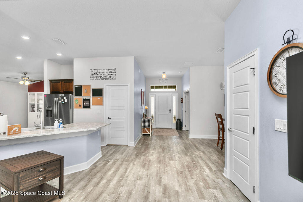 711 Tupelo Circle Cocoa, FL 32926 - Photo 6 of 47 a view of kitchen with stainless steel appliances refrigerator stove microwave and furniture