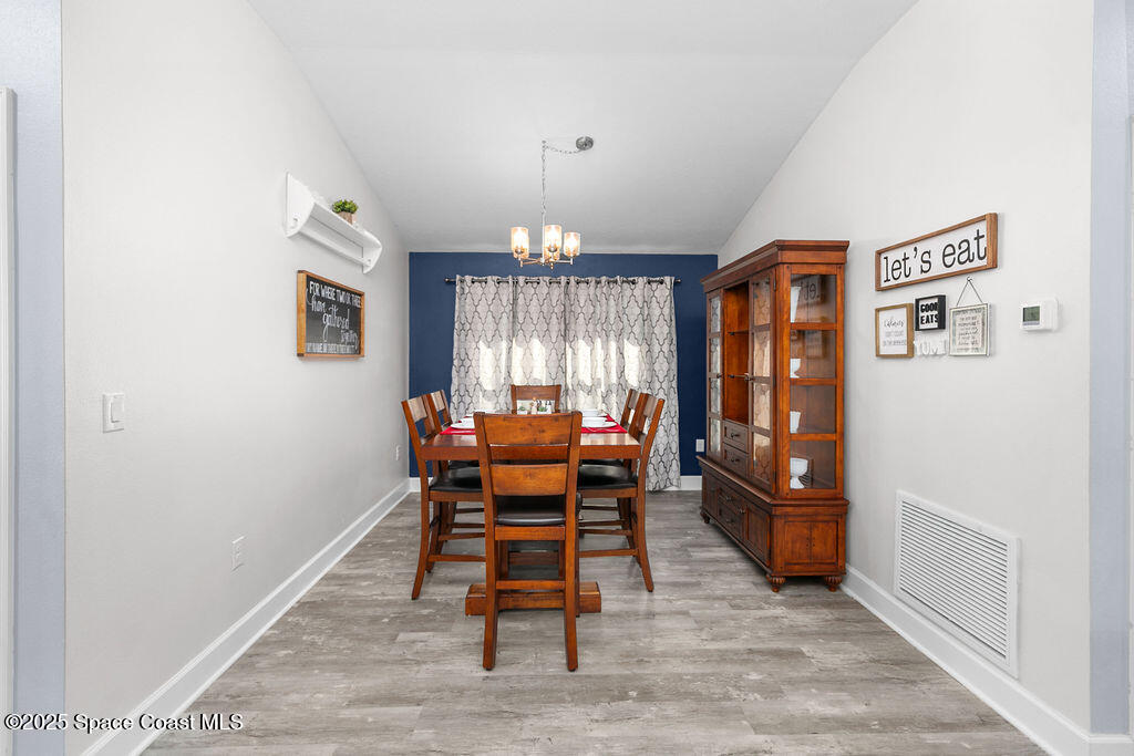 711 Tupelo Circle Cocoa, FL 32926 - Photo 9 of 47 a dining room with furniture and window