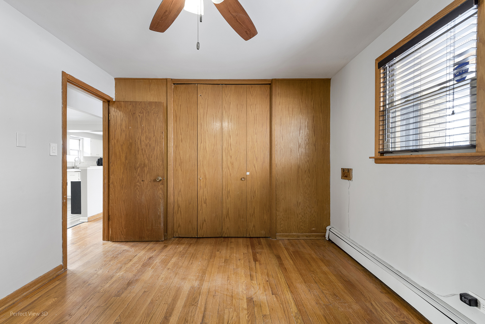 10900 Rutherford Avenue Worth, IL 60482 - Photo 12 of 21 an empty room with wooden floor and windows