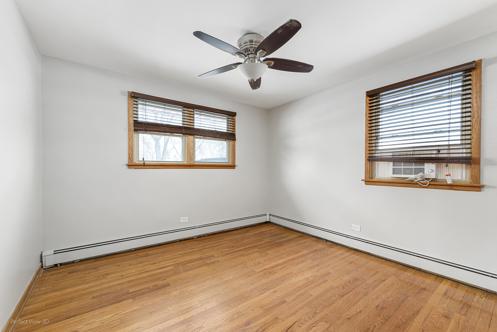 10900 Rutherford Avenue Worth, IL 60482 - Photo 13 of 21 a view of an empty room with wooden floor and a window