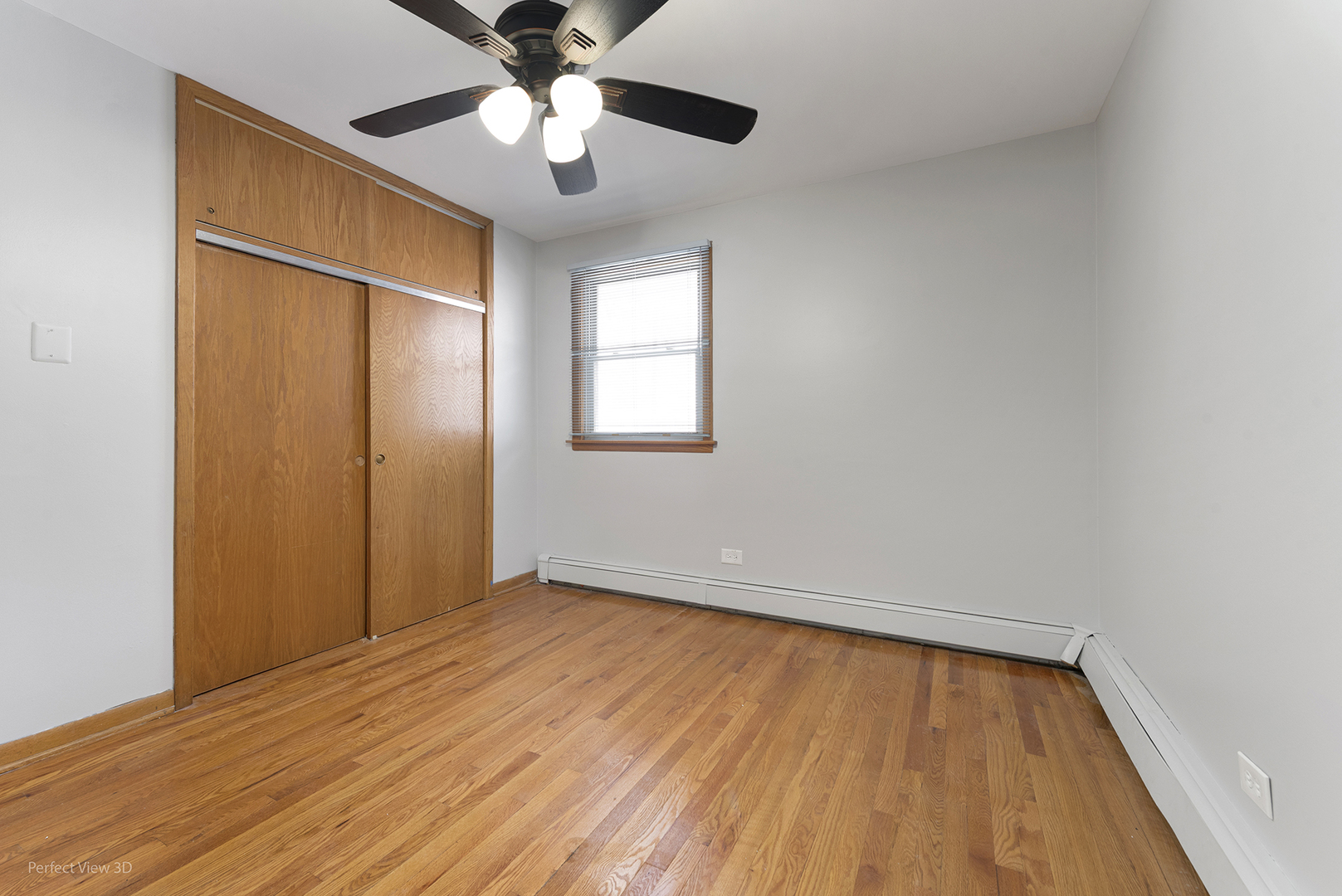 10900 Rutherford Avenue Worth, IL 60482 - Photo 15 of 21 a view of an empty room with wooden floor and a window