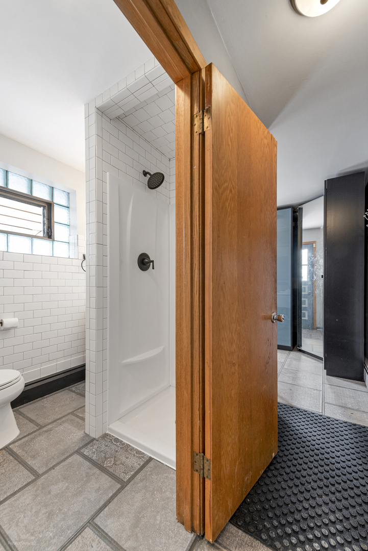 10900 Rutherford Avenue Worth, IL 60482 - Photo 17 of 21 a view of a bathroom with a glass door shower