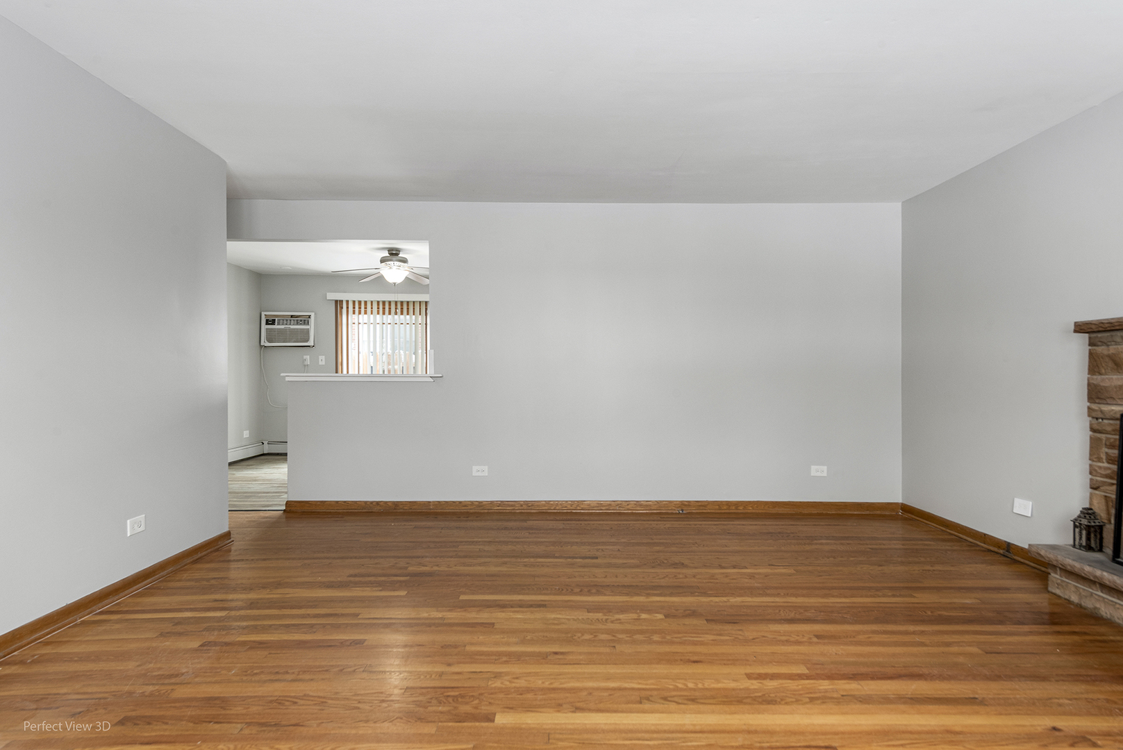 10900 Rutherford Avenue Worth, IL 60482 - Photo 5 of 21 a view of an empty room with wooden floor and a window