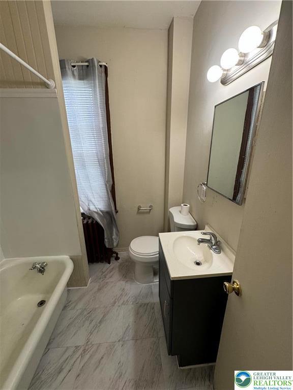 1503 Washington Street, Unit 2 Wilson, PA 18042 - Photo 13 of 28 a bathroom with a tub sink and mirror