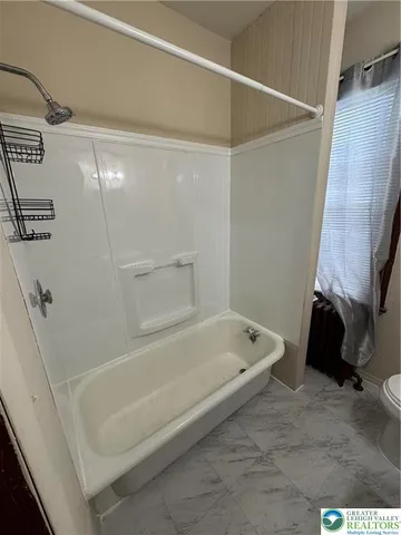 a bathroom with a bathtub