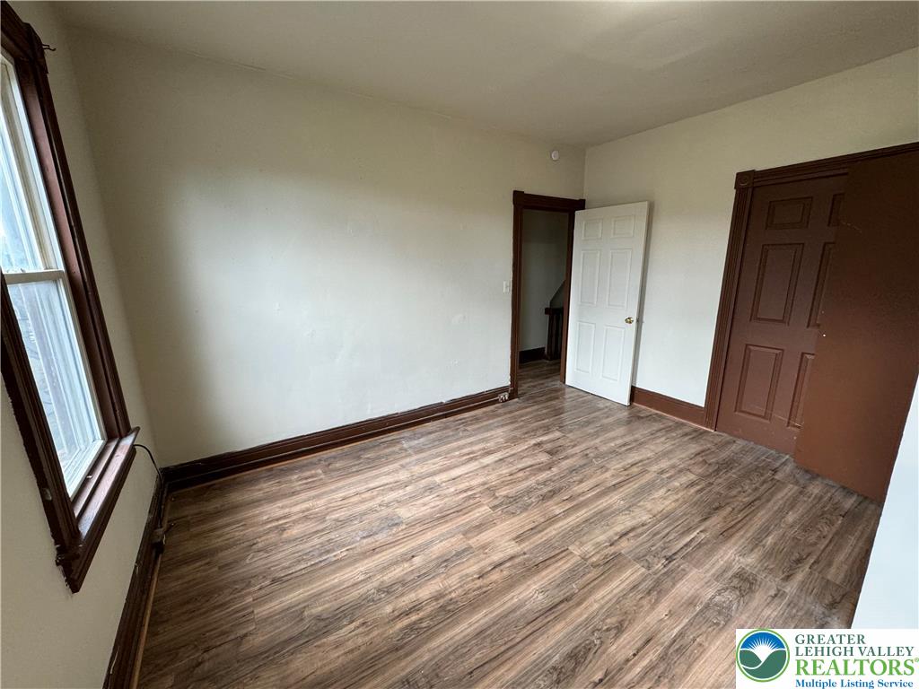 1503 Washington Street, Unit 2 Wilson, PA 18042 - Photo 21 of 28 a view of an empty room and wooden floor