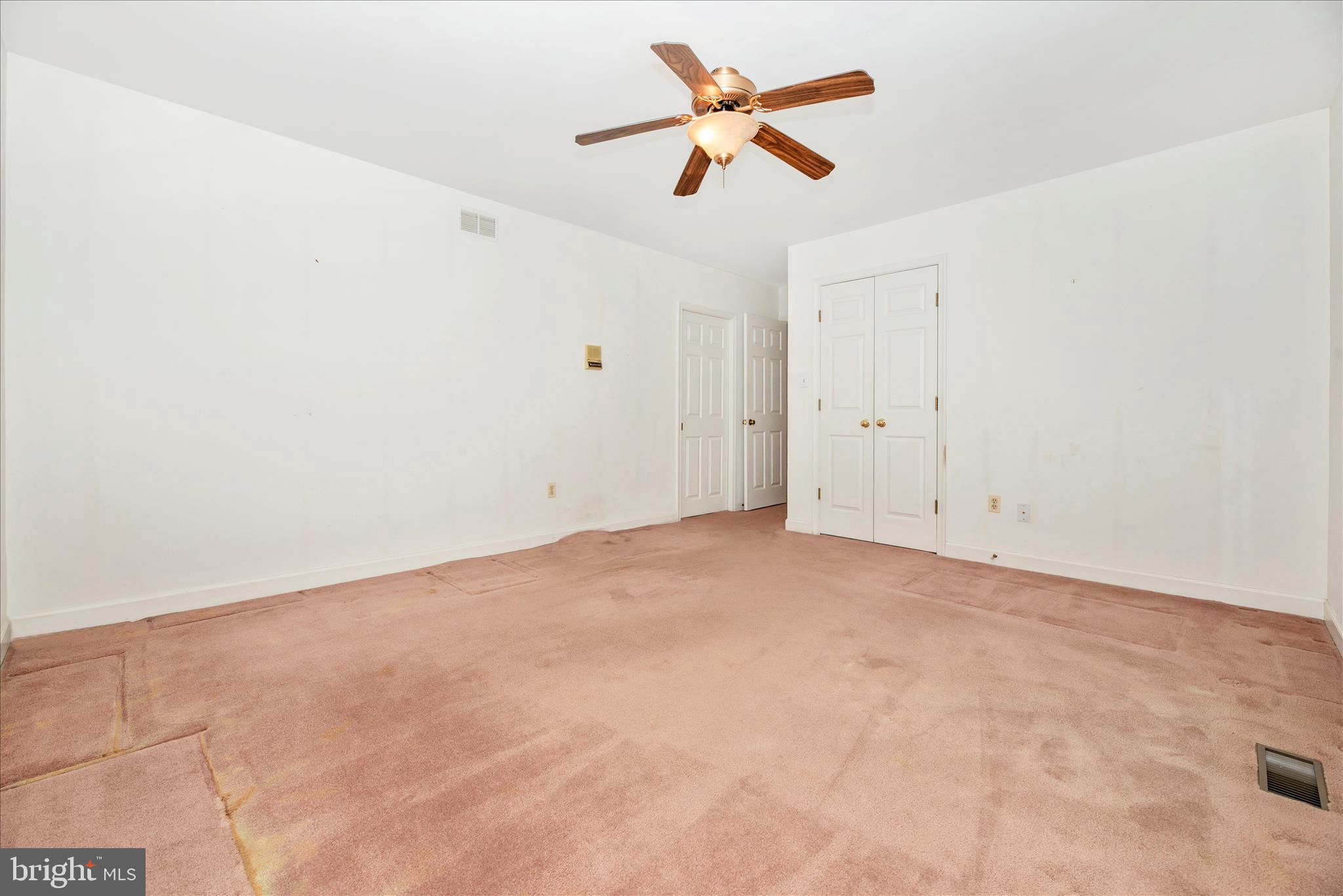 2221 Gold Mine Road Brookeville, MD 20833 - Photo 37 of 60 an empty room with a ceiling fan and a window