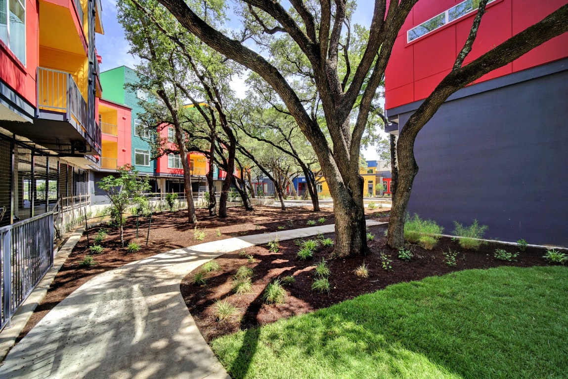 13130 Pond Springs Road, Unit 3212 Austin, TX 78750 - Photo 3 of 33 a view of backyard with outdoor seating and trees