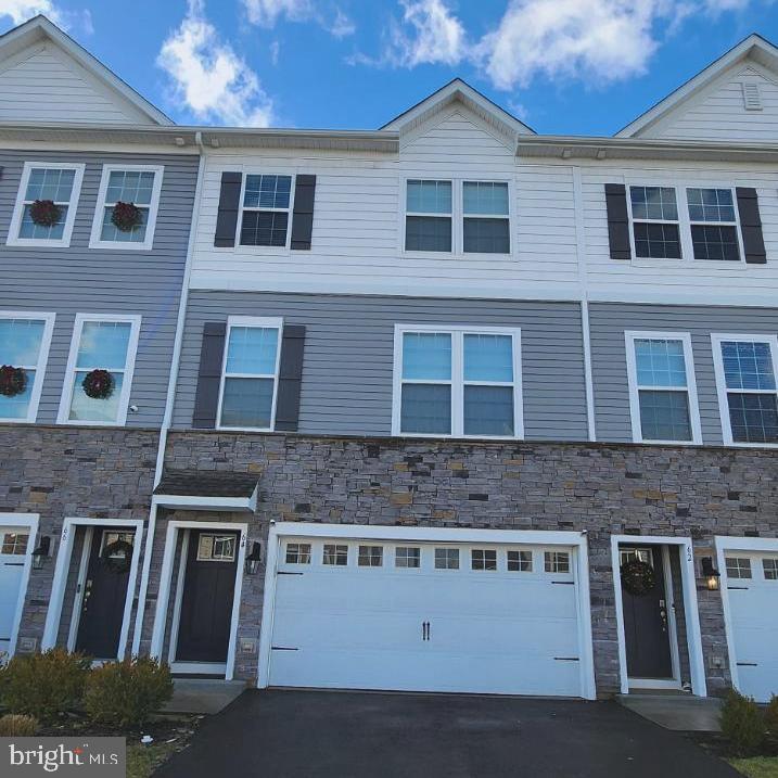 Charming townhouse under a bright blue sky.