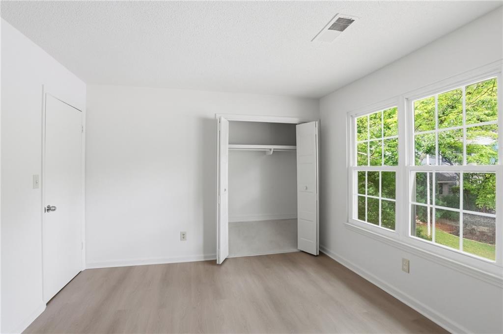 413 Promenade Court Marietta, GA 30064 - Photo 16 of 28 an empty room with windows