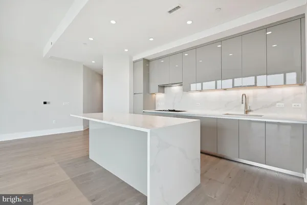 a kitchen with counter top space and cabinets