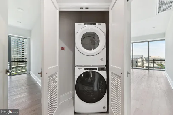 a view of a hallway with washer and dryer