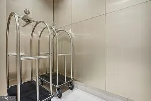 a bathroom with a glass shower door and mirror