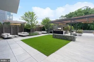 a view of a patio with a table and chairs