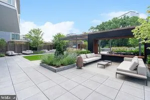 a view of a patio with couches and a table and chairs