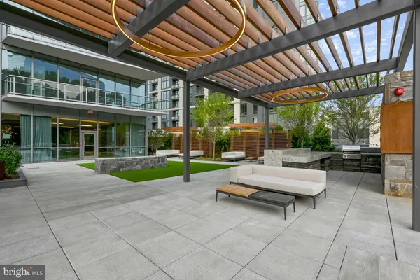 a view of swimming pool with outdoor seating
