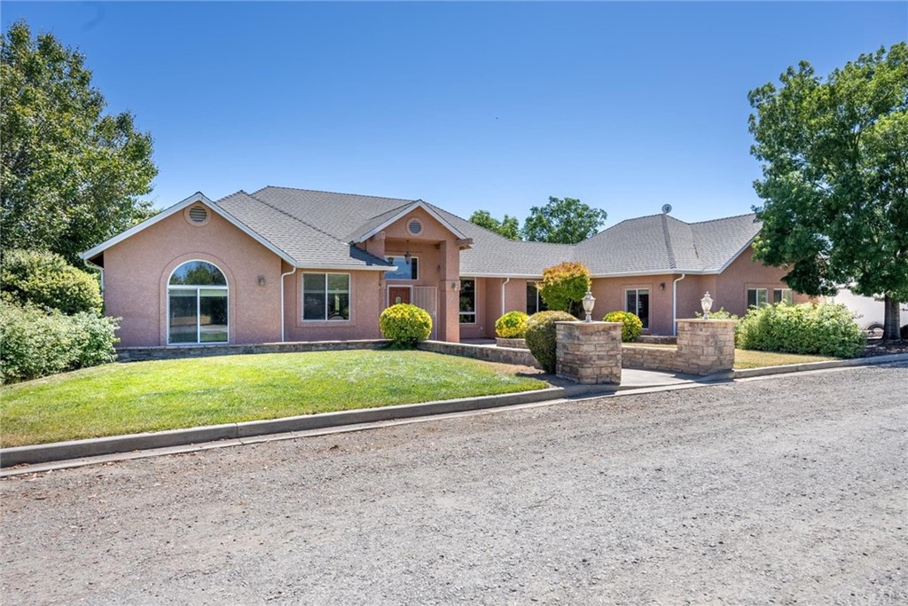 5941 Walnut Road Corning, CA 96021 - Photo 1 of 1 a front view of a house with garden